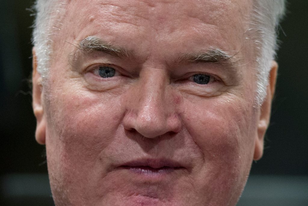 FILE — Bosnian Serb military chief Ratko Mladic enters the Yugoslav War Crimes Tribunal in The Hague, Netherlands, to hear the verdict in his genocide trial, Wednesday, Nov. 22, 2017 (AP Photo/Peter Dejong, Pool, File)